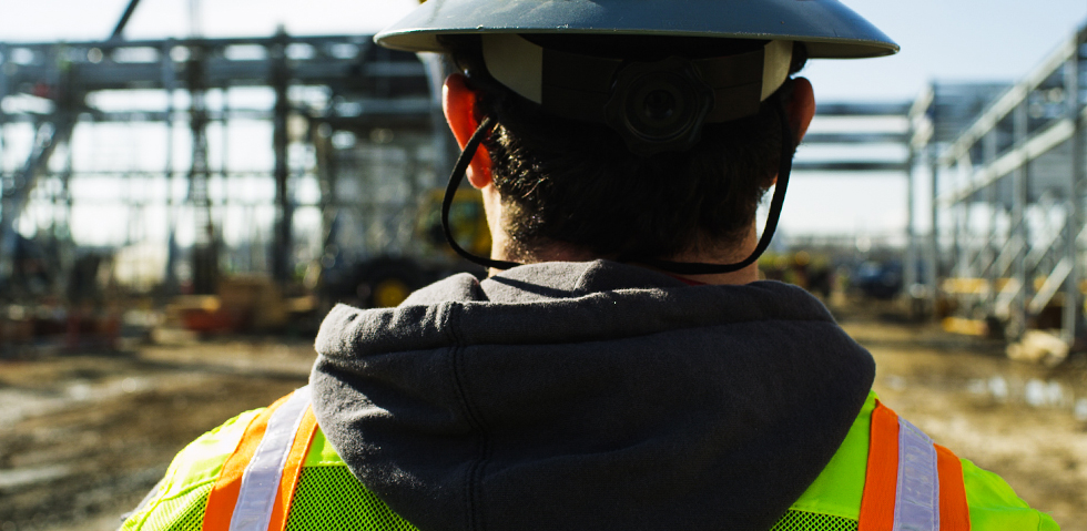 Kuraray America Walking Behind Construction Worker