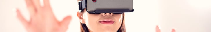 Young Woman Wearing VR Headset Experiencing Augmented Reality Video Young Woman Wearing VR Headset Experiencing Augmented Reality Video