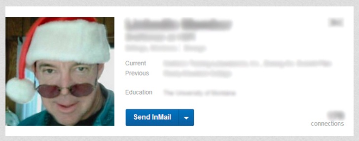 Terrible Creepy LinkedIn Photo of Guy in Santa Hat and Sunglasses